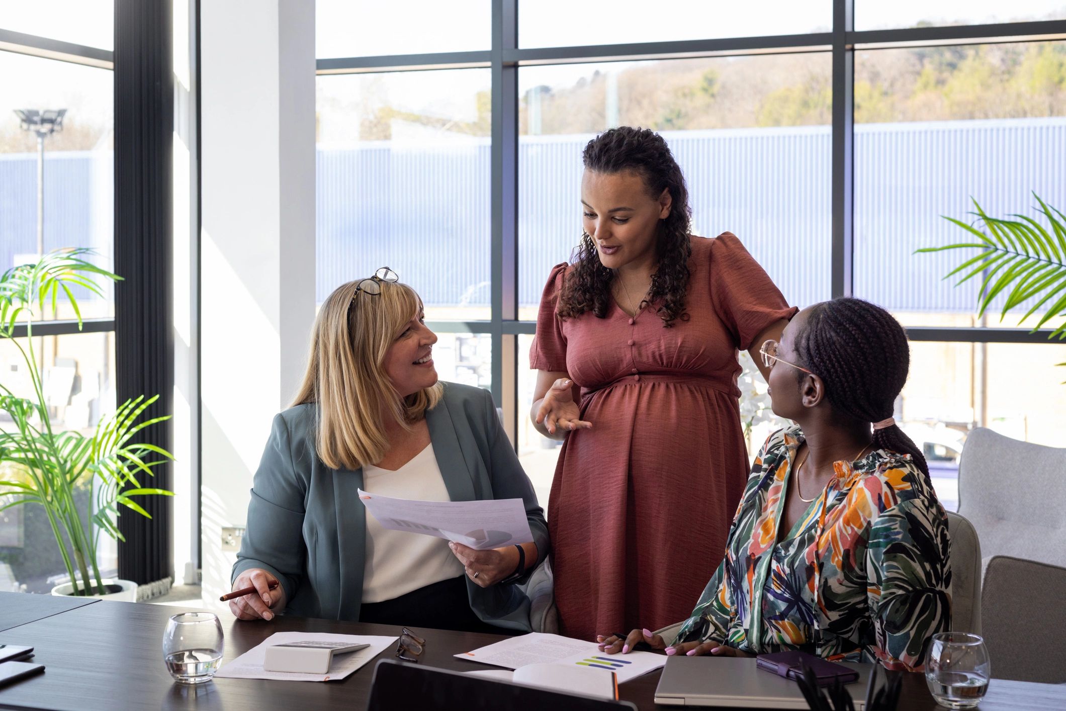 Colleagues reviewing plans at a table